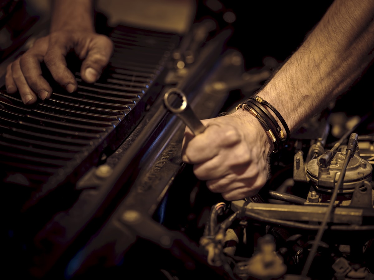 Technician's hands running an engine diagnostic check