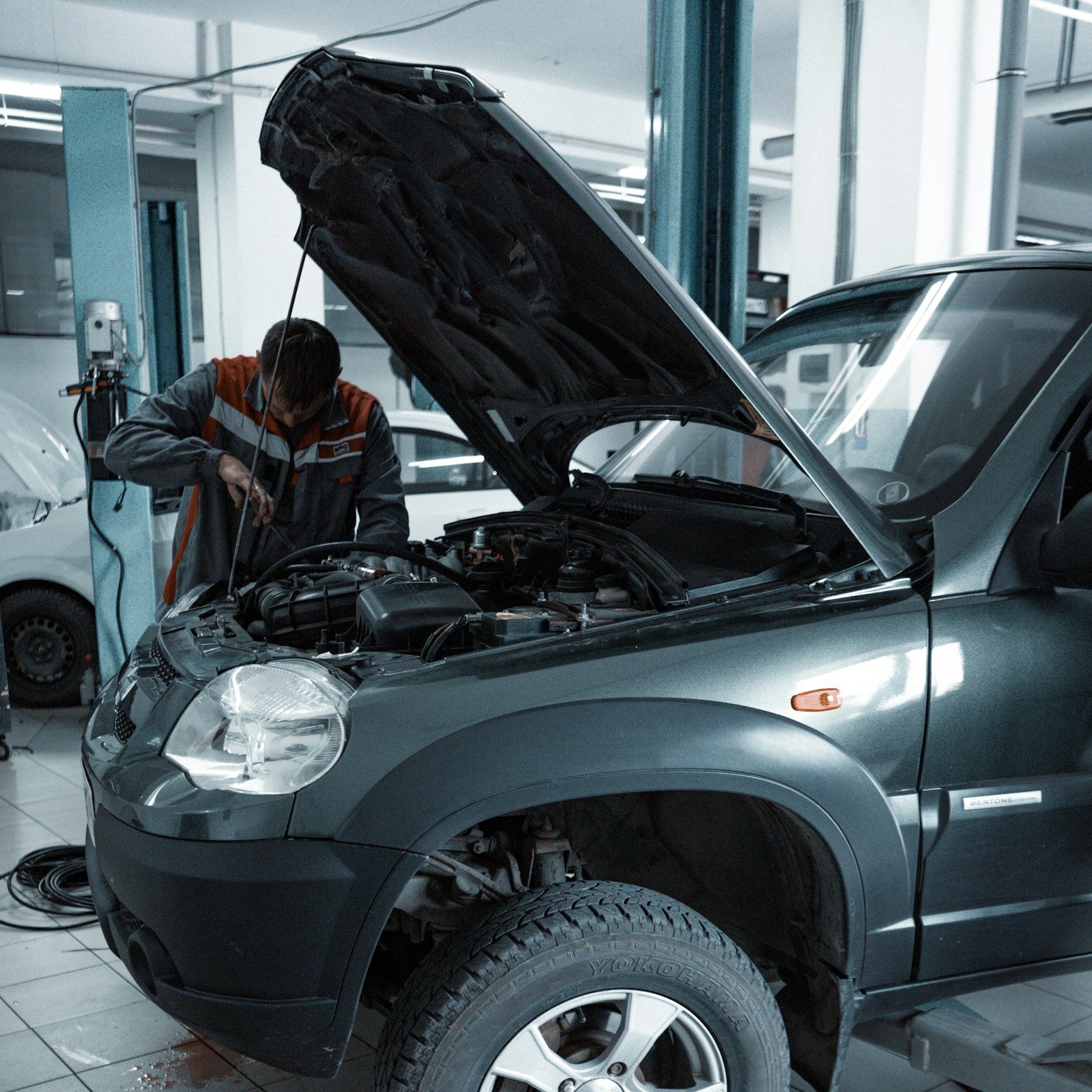 Interior of Ironline Auto Body collision repair shop bay in Denver